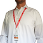 A person in a white shirt is wearing the Red Printed Visitor Lanyard with Swivel Hook (P/N 2138-5220) which provides added safety with its breakaway feature and swiveling hook for convenience.