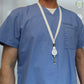 A person dressed in blue medical scrubs is equipped with the Breakaway Lanyard ID Holder Badge Reel Combo (2138-700X).