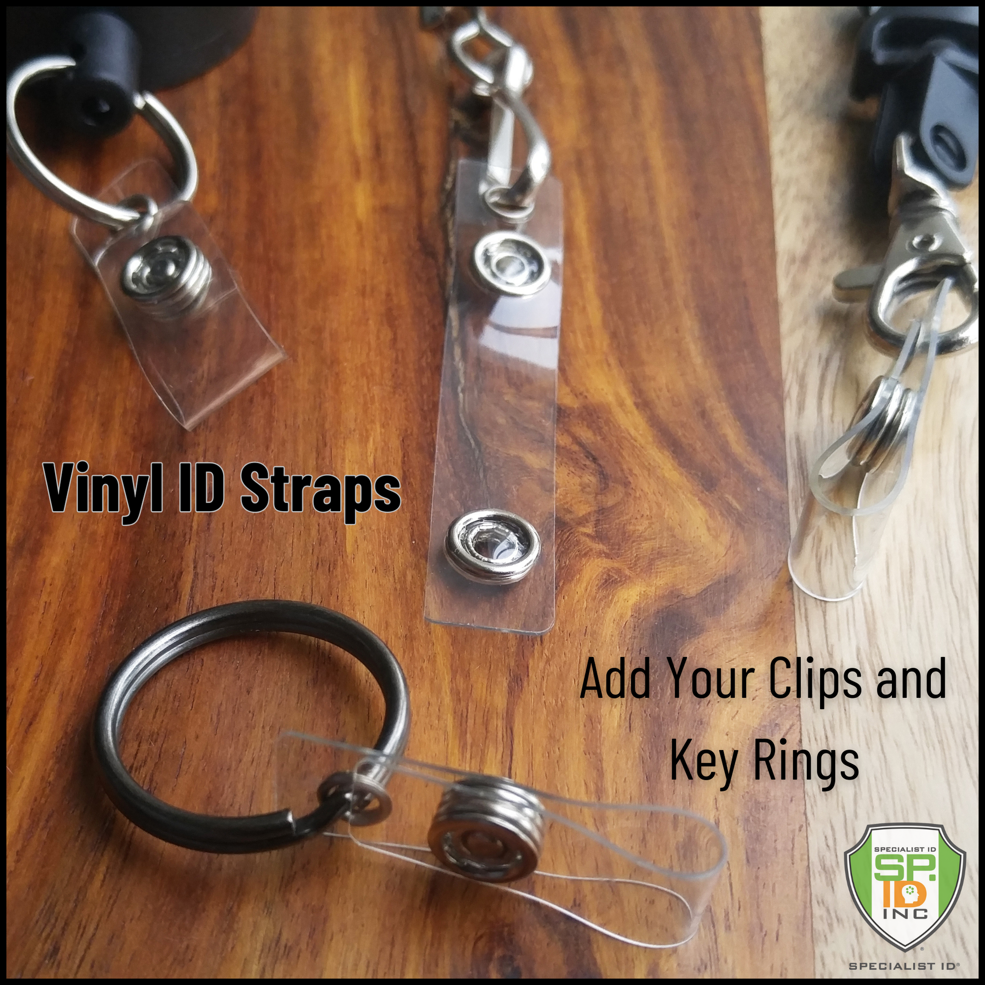 A close-up image of the Key Ring to ID Badge Converting Vinyl Strap Clip 2120-1250 on a wooden surface. The text reads, "Key Ring to ID Badge Converting Vinyl Strap Clip 2120-1250. Add Your Clips and Key Rings" along with a logo in the bottom right corner. Perfect for customizing your ID badge holder with vinyl strap clips and key ring accessories.