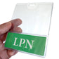 A hand holds a clear plastic badge holder with a green insert displaying the letters "LPN." These LPN BadgeBottom Badge Holder & LPN Badge Buddy IN ONE!! - Horizontal ID Badge Sleeve with Bottom Role Tag for Nurses are made from durable composite material, ensuring they last through daily wear and tear.