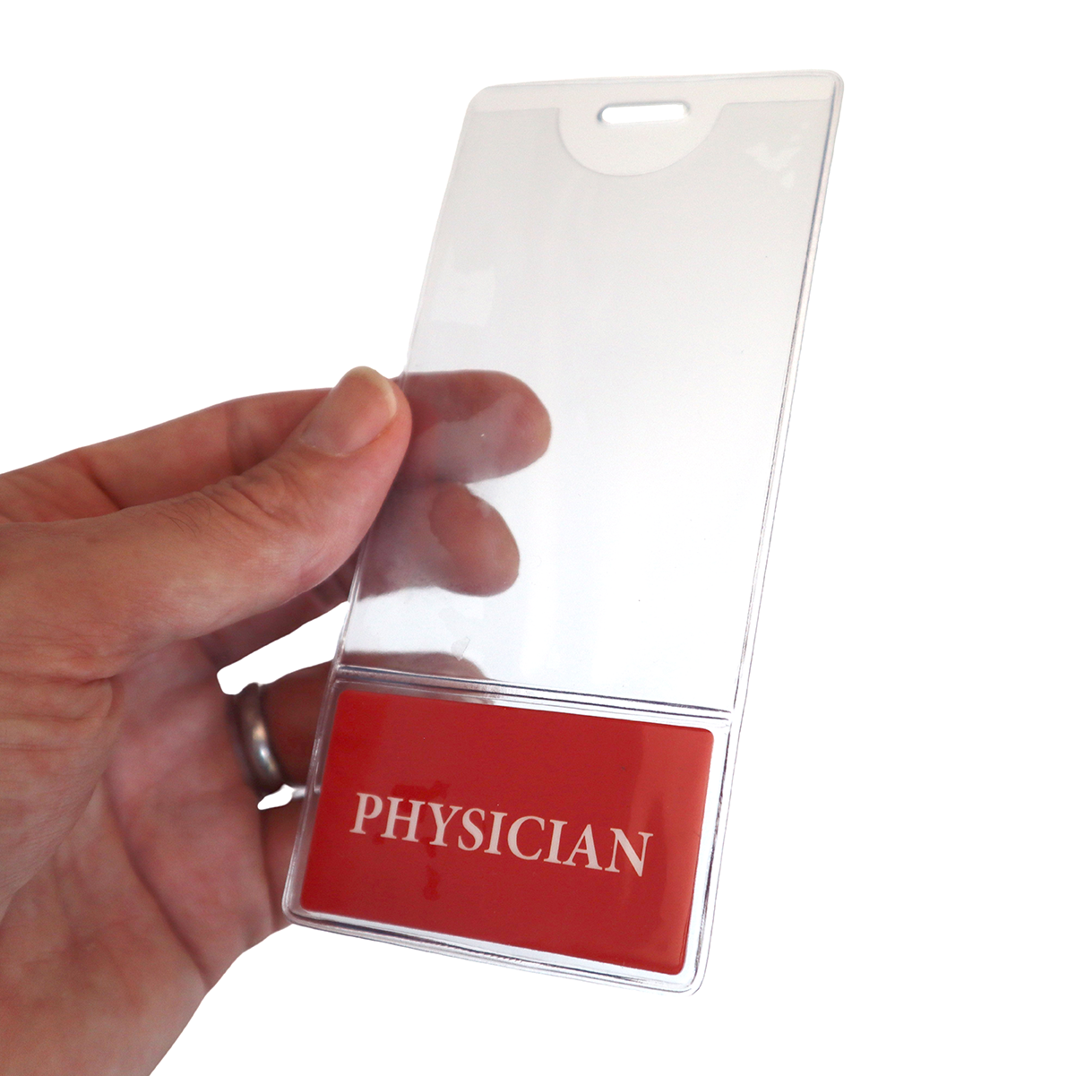 A hand holds a clear plastic ID badge holder with a red section labeled "PHYSICIAN." The PHYSICIAN BadgeBottom Badge Holder & Badge Buddy IN ONE!! - Vertical ID Badge Sleeve with Bottom Role Tag for Doctors, featuring customizable titles, make it easy to identify healthcare professionals.