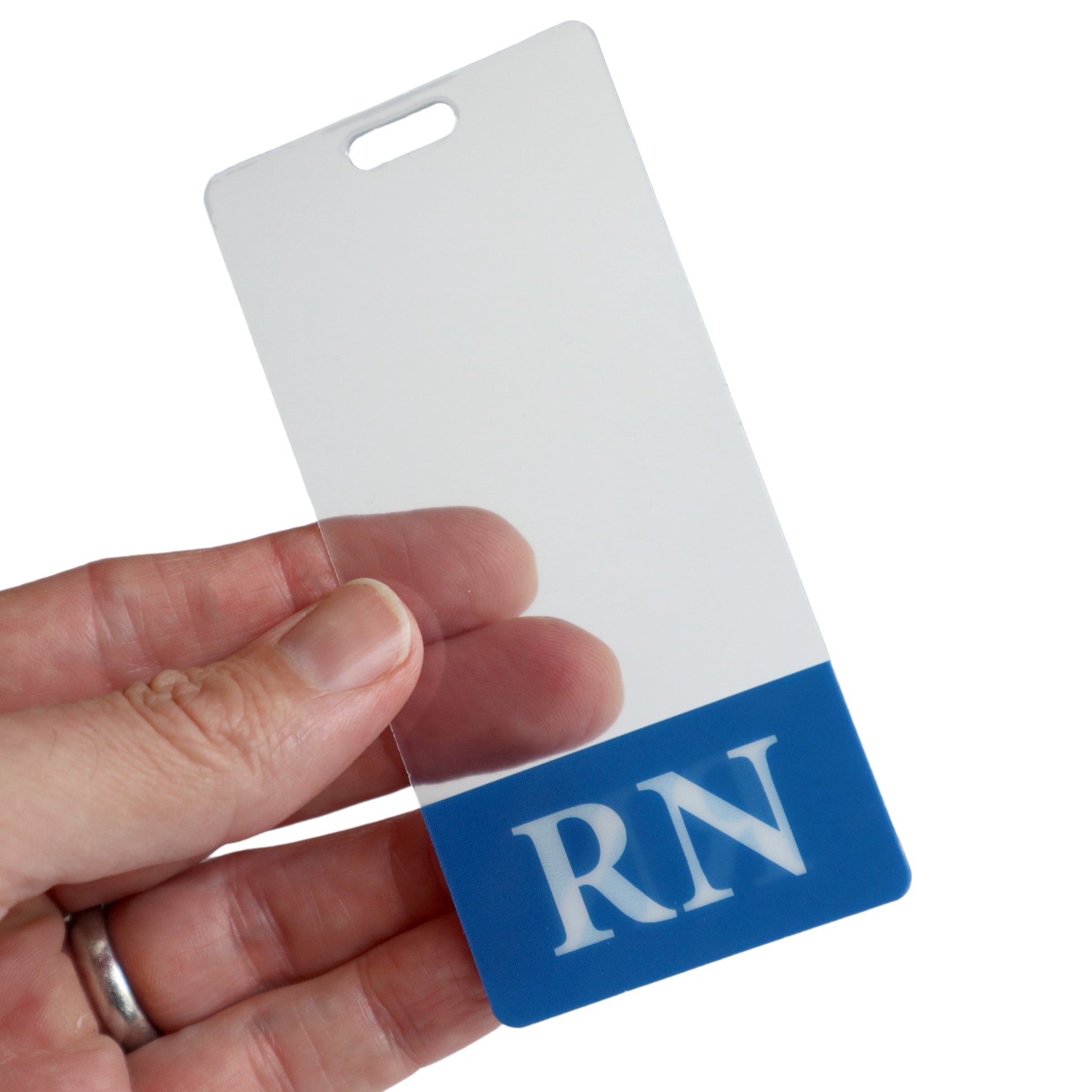 A hand holds a Clear RN Badge Buddy Vertical with Color Border for Registered Nurses - Double Sided Print, featuring a blue section at the bottom displaying the letters "RN".