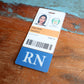 A photo ID badge for "Cindy Smith" in Operations, featuring a picture, barcode, and a Clear RN Badge Buddy Vertical with Color Border for Registered Nurses - Double Sided Print at the bottom. Issued since March 2021 for instant role recognition.