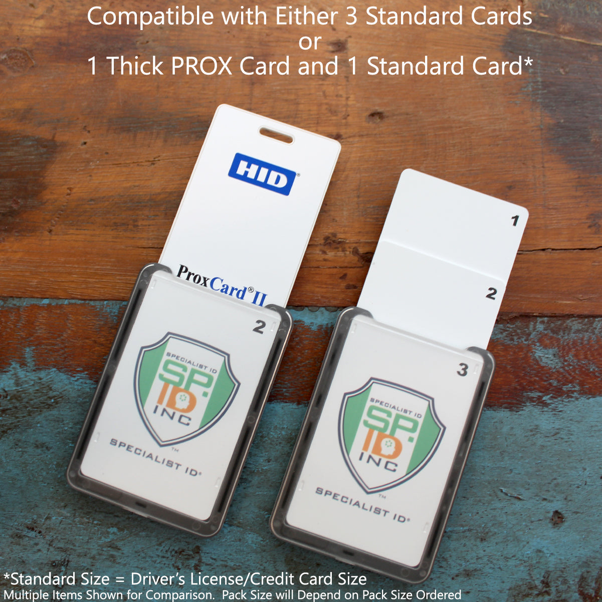 Two Specialist ID Top Loading THREE ID Card Badge Holders sit on a table, compatible with three standard cards or one thick PROX card and a standard card. Easily combine them with the heavy-duty lanyard that includes a detachable metal clip and key ring for convenience and safety.