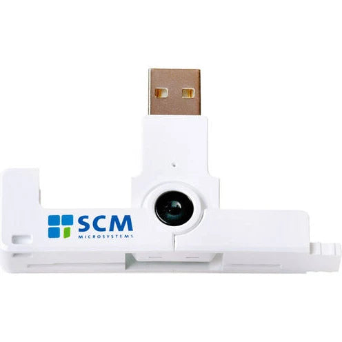 A white SCR3500 Smart Card Reader - SCM SCR 3500 with the "SCM Microsystems" logo, featuring a circular lens in the center. This ISO7816 compliant device is perfect for military CaC cards, ensuring top-notch security and reliability.