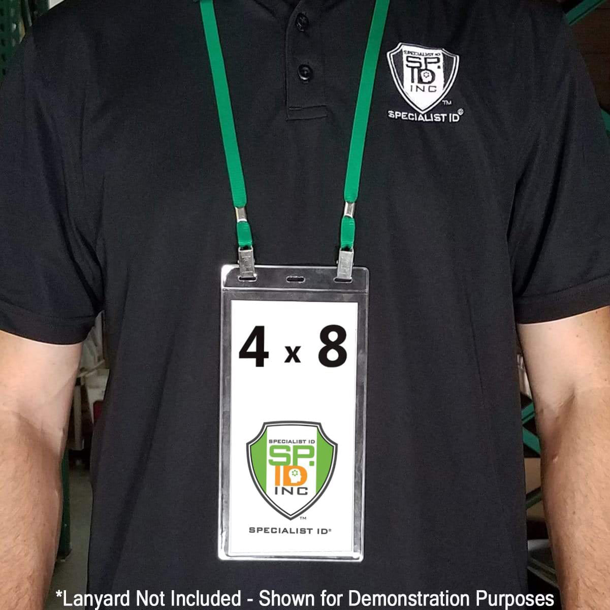 A person wearing a black polo shirt with a green lanyard and an extra large ticket holder, specifying "4x8 Inch Extra Large Ticket or Credential Holder With 3 Euro Slots SPID-1040", displaying a card that reads "4 x 8" with a company logo. Text at the bottom states "Lanyard Not Included.