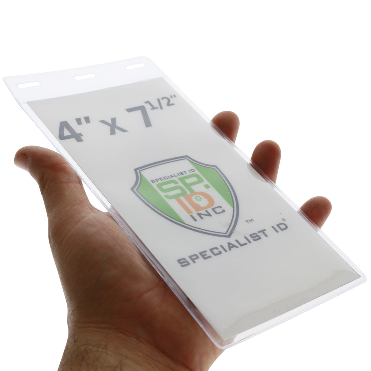 A hand holds a Vertical Oversized 4X7 Vinyl ID Badge & Ticket Holder (XL47.5V) with an insert that reads "4" x 7 1/2", Specialist ID Inc." and features a shield logo, perfect for large format tickets or event passes.