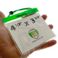 A hand holding a 4x3 Inch Color Bar Event Badge with Adjustable Lanyard - Extra Large (Max Insert 4 3/8 X 3 1/2) Colored Name Badge with Matching Color Code Lanyard (1860-290X), displaying a card labeled "4 1/2" x 3 5/8" and the logo "Specialist ID Inc.