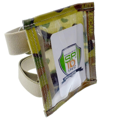 A camouflaged tactical armband featuring a clear plastic pocket, displaying an ID card with a green and orange logo and the text "Specialist IQ SR10 Inc." Perfect as a Raine Military ID Badge Armband Holder with Two Straps (SPID-1090).